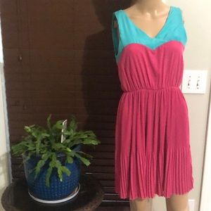 Every Size Small Turquoise Blue with Deep Pink Pleated Contrast. Made is USA.